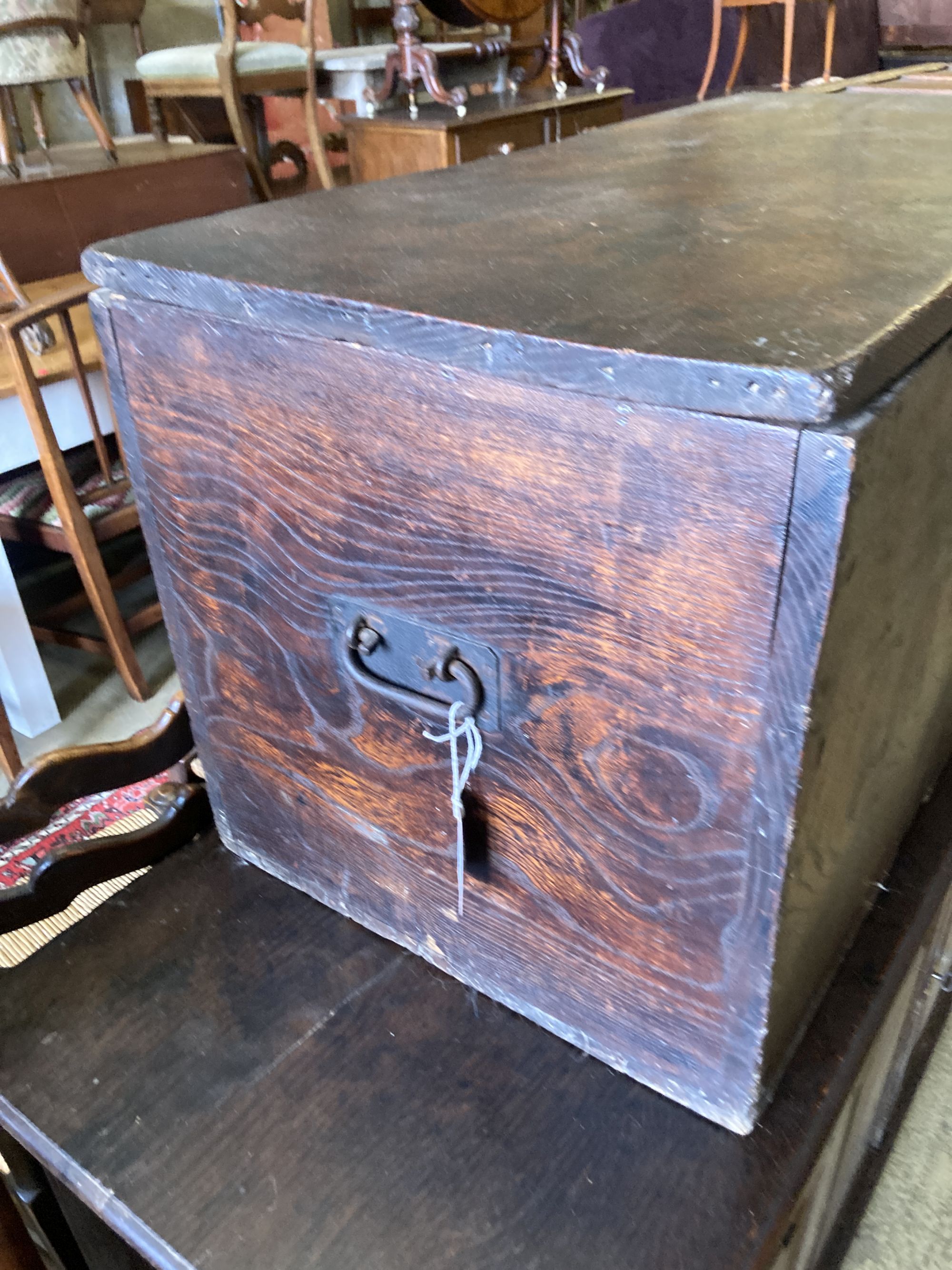 A 19th century elm trunk, with side carrying handles, length 89cm, depth 44cm, height 46cm